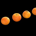Fresh Ripe Oranges Arranged In A Straight Row On Black Background