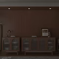 Wooden Sideboard with Glass Doors and Decorative Items Near Plant and Side Table