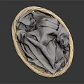 Wicker Storage Basket Containing Soft Gray Cloth For Daily Household Items