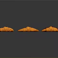 Sculpture Carving Of Three Orange Croissants With Striped Surface Design Details