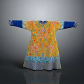 Model Wearing Yellow Traditional Robe With Blue Cuffs And Intricate Floral Patterns