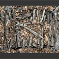 Textured Stacked Wood And Stone In Metal Frame Against Dark Background