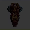 Vibrant Mythical Monster Head Sculpture With Red Blue Details And Sharp Orange Teeth
