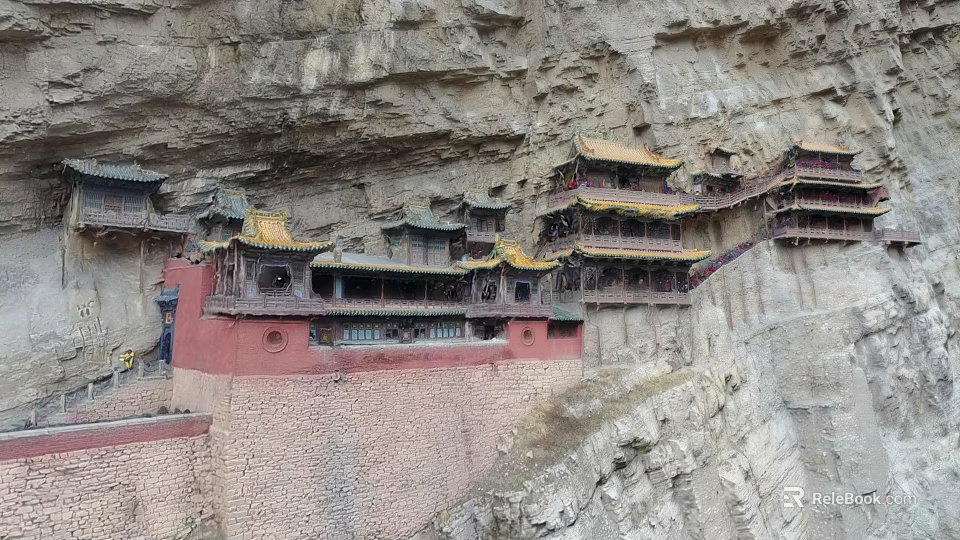 Ancient Cliffside Architecture With Multi Story Structure Yellow Roofs And Red Walls 3d model