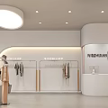 Modern Stylish Clothing Store Interior With Mannequins Clothing Racks And Green Plants