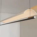 Modern Linear Pendant Light With Curved Top And Warm Illumination For Dining Space