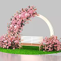 Floral Installation With Pink Flower Arch And Wooden Bench On Green Grass