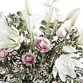 Clear Glass Vase With White Lilies Pink Roses Green Leaves And Small White Flowers