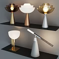 Modern Table Lamps With Gold Silver White Bases And Sleek Designs On Shelf