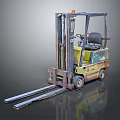 Worn Yellow And Green Industrial Forklift With Metal Forks And Cab