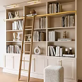 Elegant Bookshelf Filled With Books Decorative Items Ladder And White Cabinets With Gold Handles