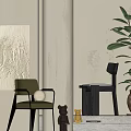 Modern Green Accent Chair With Abstract Wall Art Floor Lamp Potted Plant And Figurine
