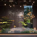 Serene Indoor Landscape With Lush Green Plants Misty Water And Decorative Stones