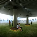 Modern Cinema Lobby With People Sitting On Benches Green Plants Unique Ceiling And Natural Light