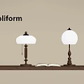 Poliform Table Lamps With Orange Shade Brass Base On Wooden Shelf Open Book Warm Light
