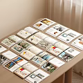 Open Magazines And Books On Wooden Table Displaying Scenery Portraits And Pages