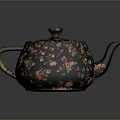 Elegant Black Teapot With Floral Patterns Wooden Handle And Gold Accents