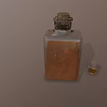 Square Glass Bottle With Cork Stopper Brown Liquid And Small Glass On Brown Background