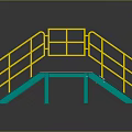 Heavy Duty Commercial Equipment With Yellow Railings And Green Ramp Structure