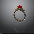 Elegant Gold Ring With Red Gemstone And Decorative Metal Details
