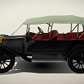 Vintage Classic Car With Soft Top Red Seats And Gold Front Grille