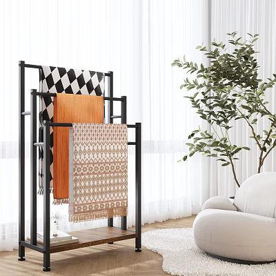 Modern Living Room With Black Metal Rack Displaying Colorful Patterned Throw Blankets And Green Plant 3d model