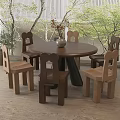 Round Wooden Dining Table Set With Six Chairs And Potted Plants In Natural Light