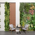 Cozy Leisure Chairs With Small Round Table Against Lush Green Plant Walls In Indoor Space