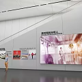 Contemporary Exhibition Hall Interior With Wall Mounted Image Displays And People