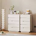 White Modern Dressers With Potted Plant Alarm Clock Photo Frame And Books