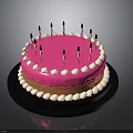 Delicious Pink Frosted Cake With White Decorative Balls And Black Candles On Black Tray