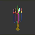 Brass Candelabra With Multiple Arms And White Candles On Black Surface