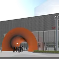 Orange Arched Entrance Gate Of Modern Audi Building With Metallic Grid Green Trees And People
