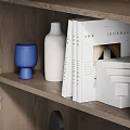 Stylish Modern Display Cabinet Featuring Layered Shelves With Decorative Vases Books And Artworks
