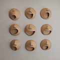 Light Brown Face Shaped Wall Decor With Various Expressions Arranged In Grid 3d model