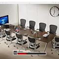 Modern Office Wooden Conference Table With Grey Wheeled Chairs Computer Monitor And Wall Clock