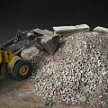 Yellow Loader At Construction Site With Rubble Pile And Large Stones