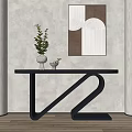 Modern Black Console Table with Z Shaped Legs Decorative Vase Green Plant Neutral Wall Art