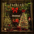 Christmas Themed Window Display With Decorated Trees Red Bows Gift Boxes Reindeer And Santa Claus