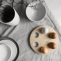 White Ceramic Tableware Set with Bowls Plates Textured Vase and Eggs on Linen Wood Tray