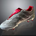 Silver Soccer Cleats With Red Laces Striped Upper And Studded Sole Design