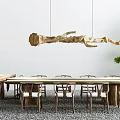 Modern Wooden Dining Table Set With Hanging Branch Light And Green Plants Decoration