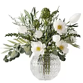 Elegant Glass Vase With White Flower Arrangement And Green Leaves
