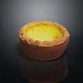 Golden Brown Crust Egg Tart With Creamy Yellow Filling On Black Reflective Surface