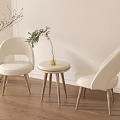 Minimalist Interior With Beige Chairs Round Side Table Green Plant Vase And Wooden Floor