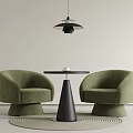 Green Armchairs With Black Cone Shaped Table And Hanging Pendant Light On Round Rug