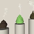 Decorative Ornament Set With Green And Brown Incense Burners On White Cylindrical Stands And Smoke