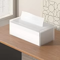 White Plastic Tissue Box Holder On Wooden Table With Window Blinds And Geometric Wall Art