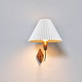 Modern Wall Lamp With White Pleated Lampshade And Wooden Base Emitting Warm Light
