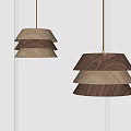 Modern Layered Wooden Pendant Lights With Different Wood Tones Hanging In Minimalist Space
